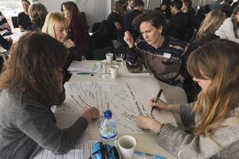 A group in discussion around a table