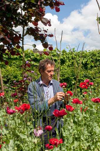 Monty Don stands in his garden